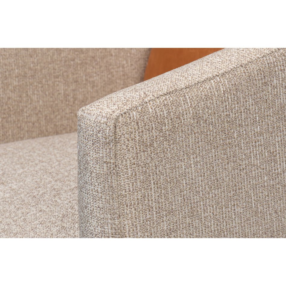Close-up of swivel chair's beige fabric texture, armrest.