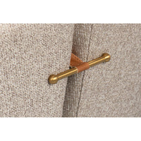Metal handle detail on back of swivel chair.