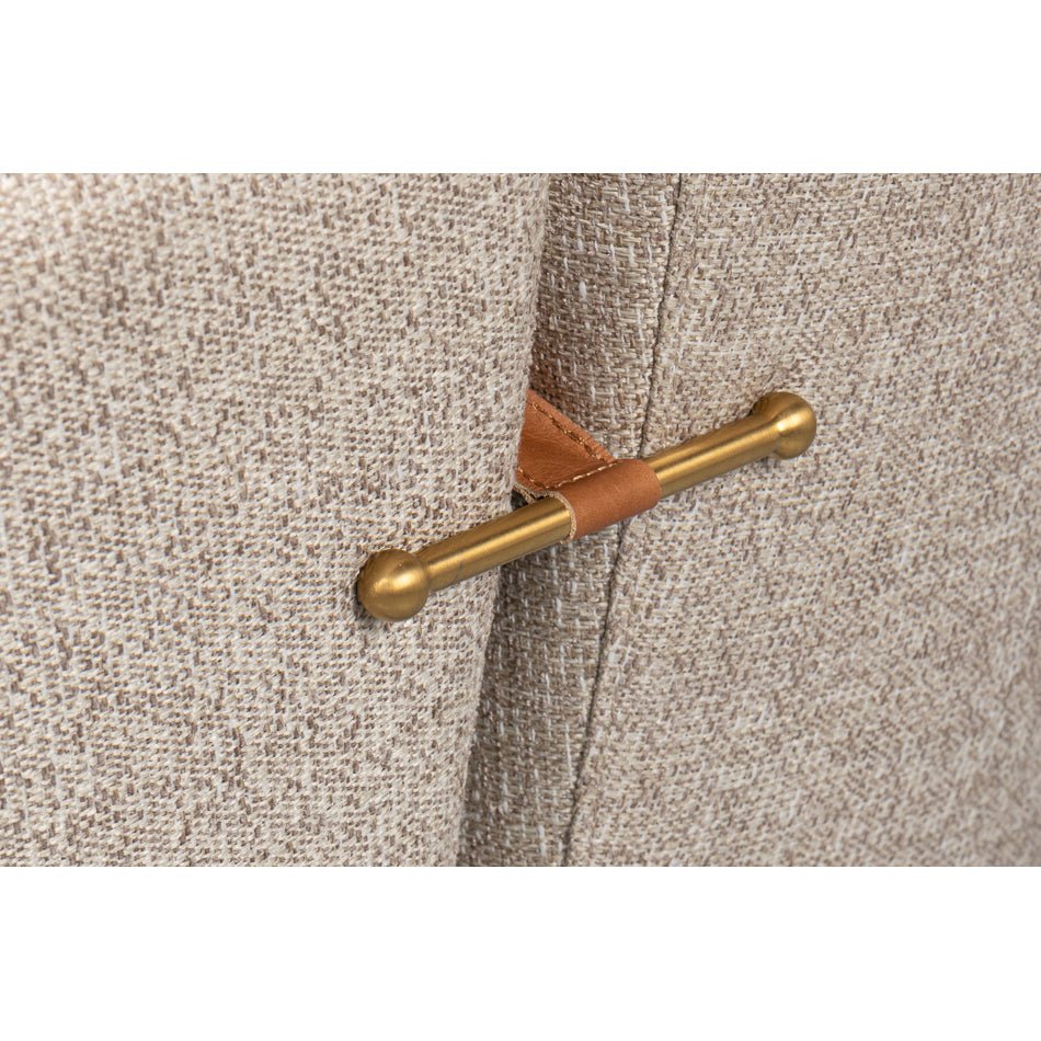 Metal handle detail on back of swivel chair.