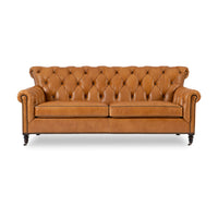 Brown tufted leather sofa, straight front view, classic style.