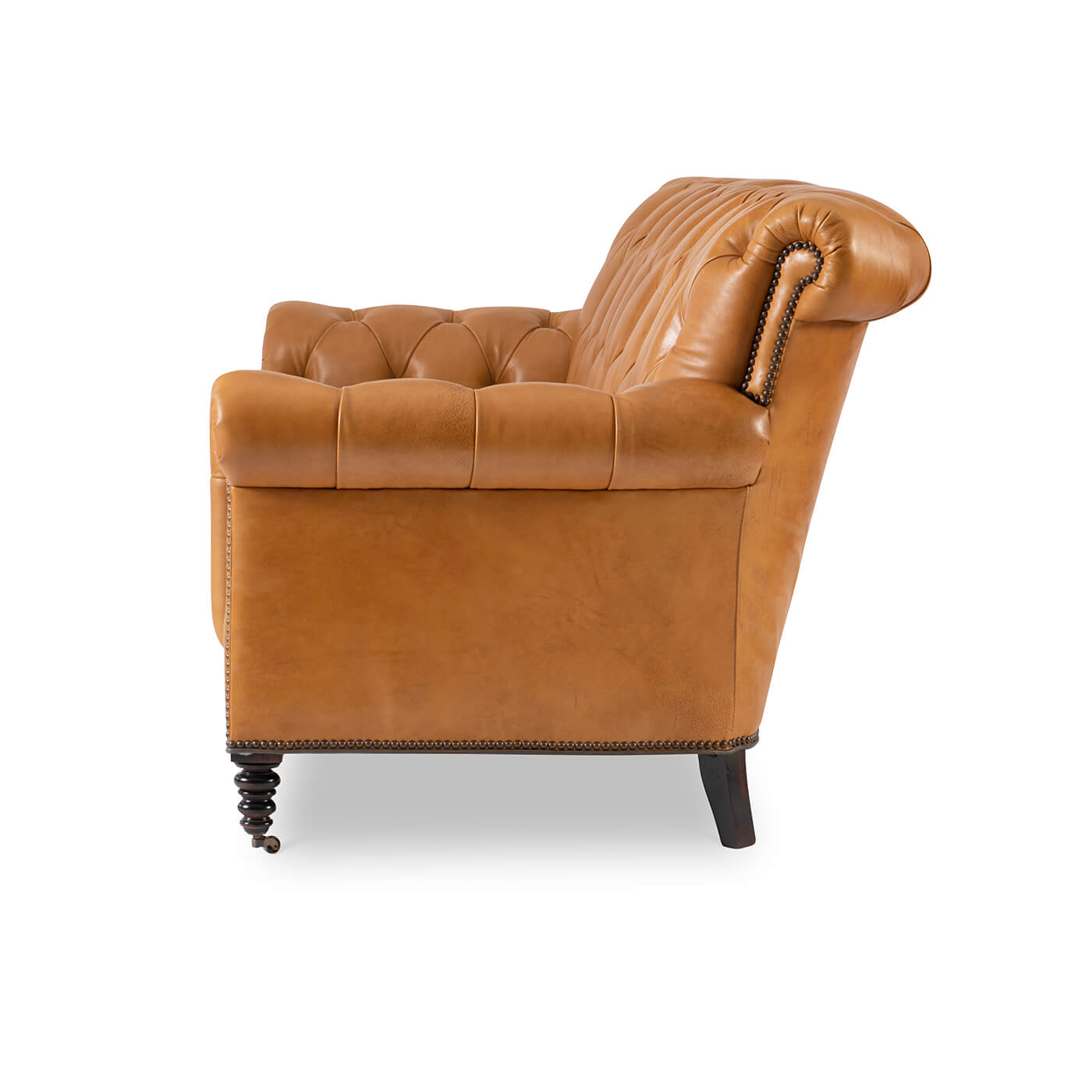 Brown tufted leather sofa, side profile, armrest details visible.