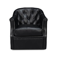 Classic tufted black leather armchair, front view detail.