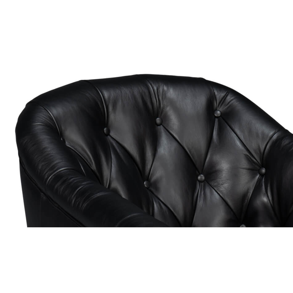 Tufted design close-up on classic black leather armchair.