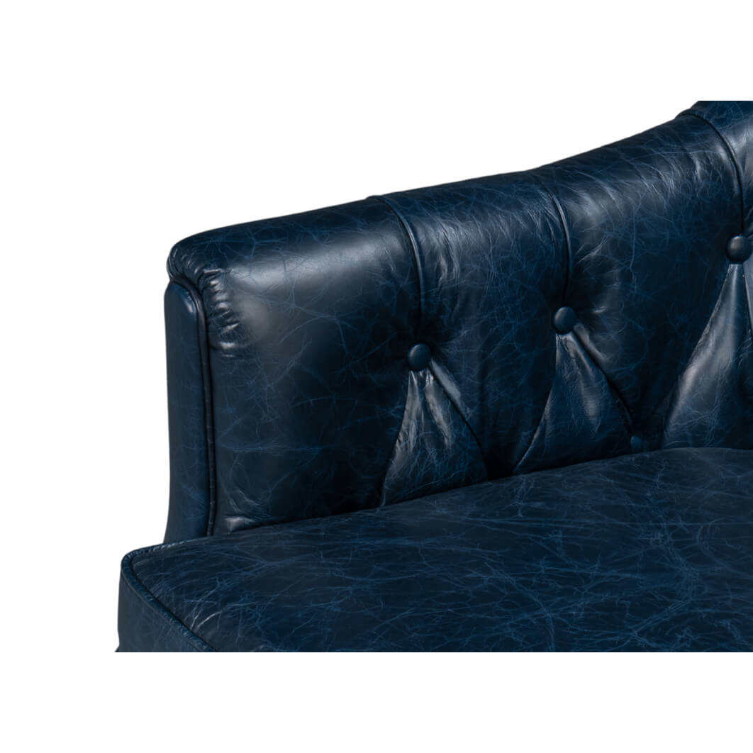Arm and cushion detail on blue leather armchair.