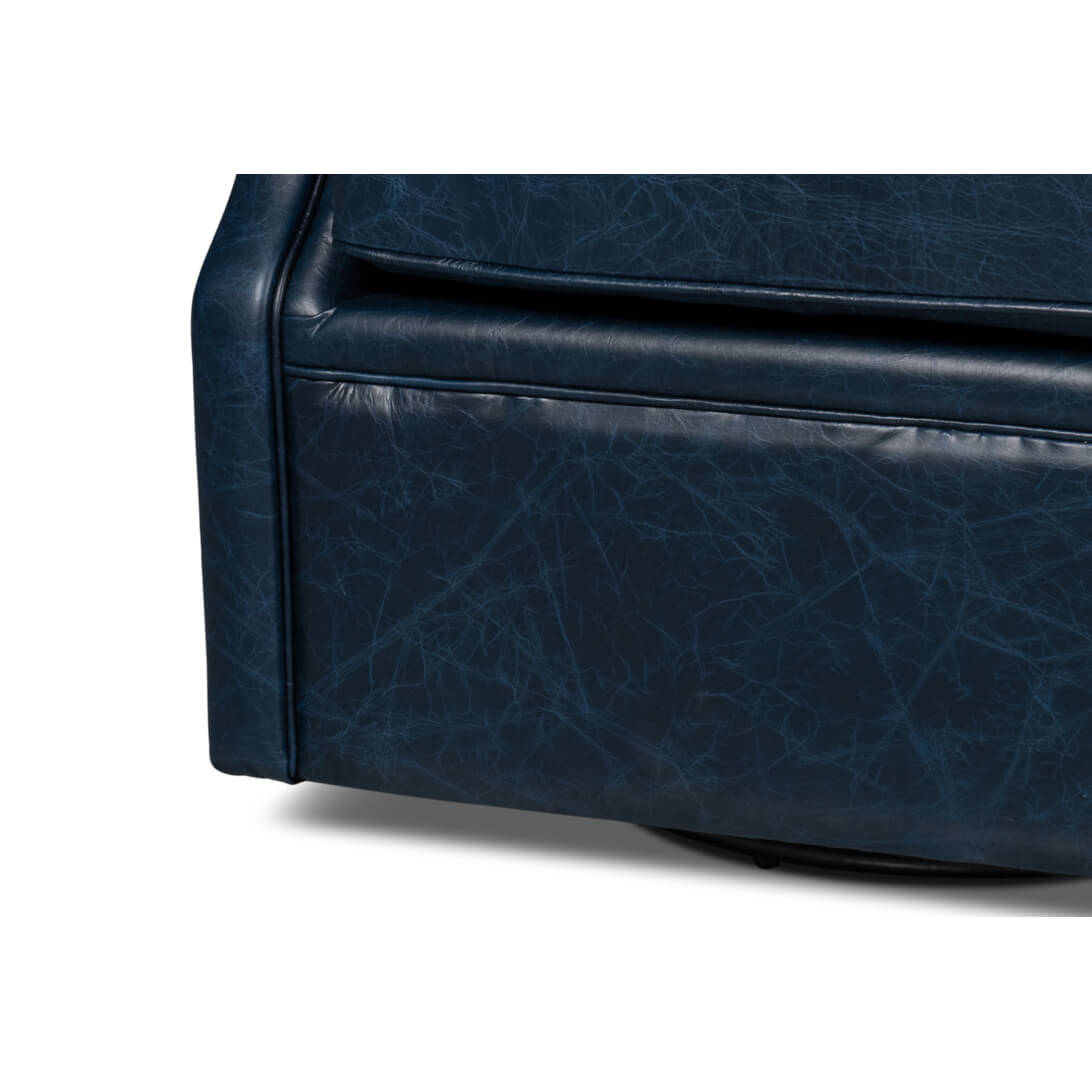 Base of blue leather armchair, close-up view.