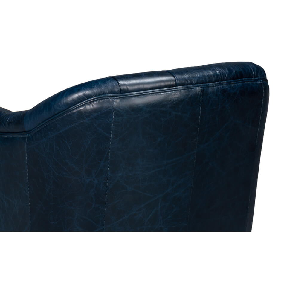 Backrest detail on blue leather armchair.