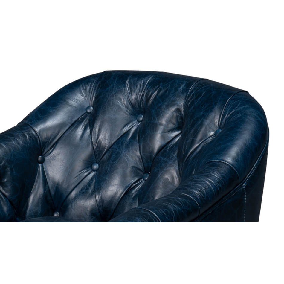 Button tufting on blue leather armchair.