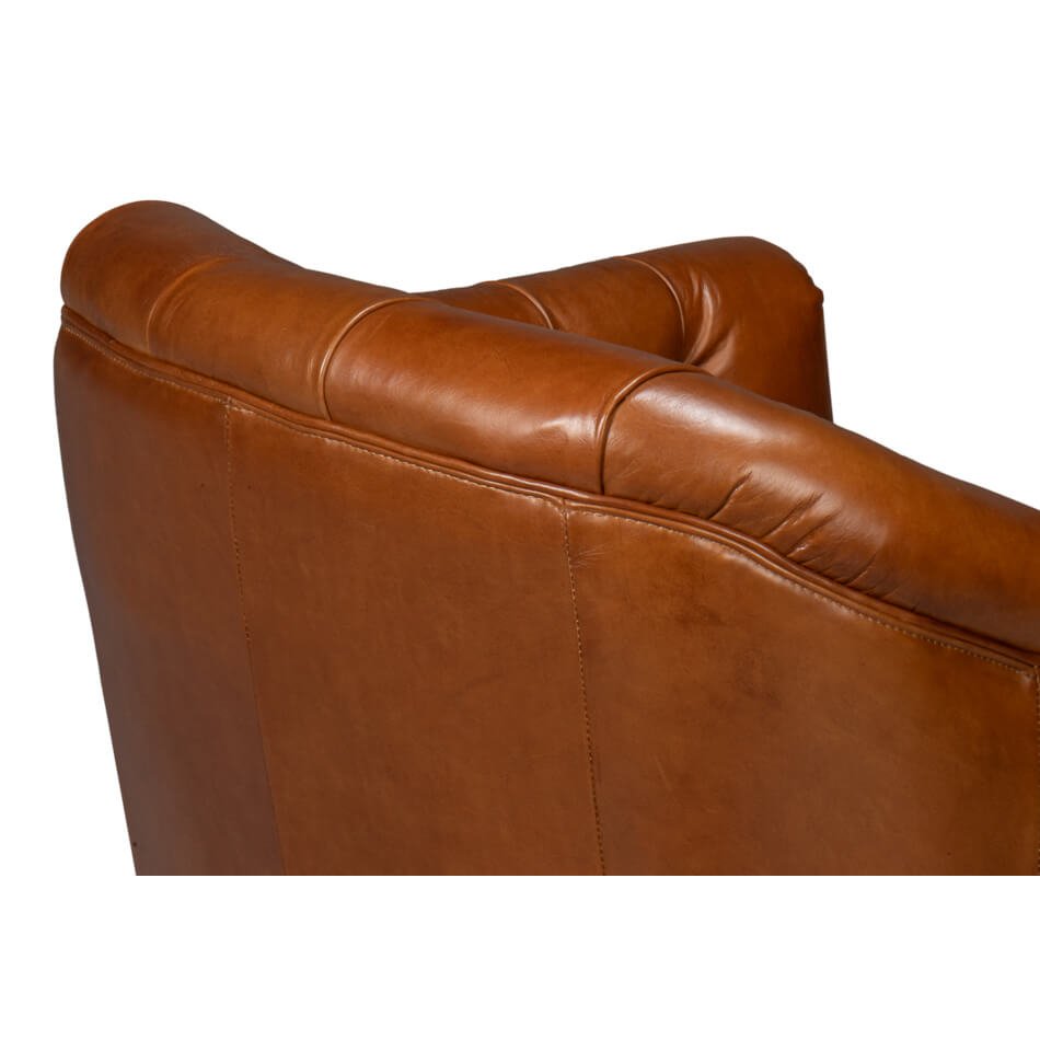 Brown leather armchair, close-up of armrest, smooth finish.