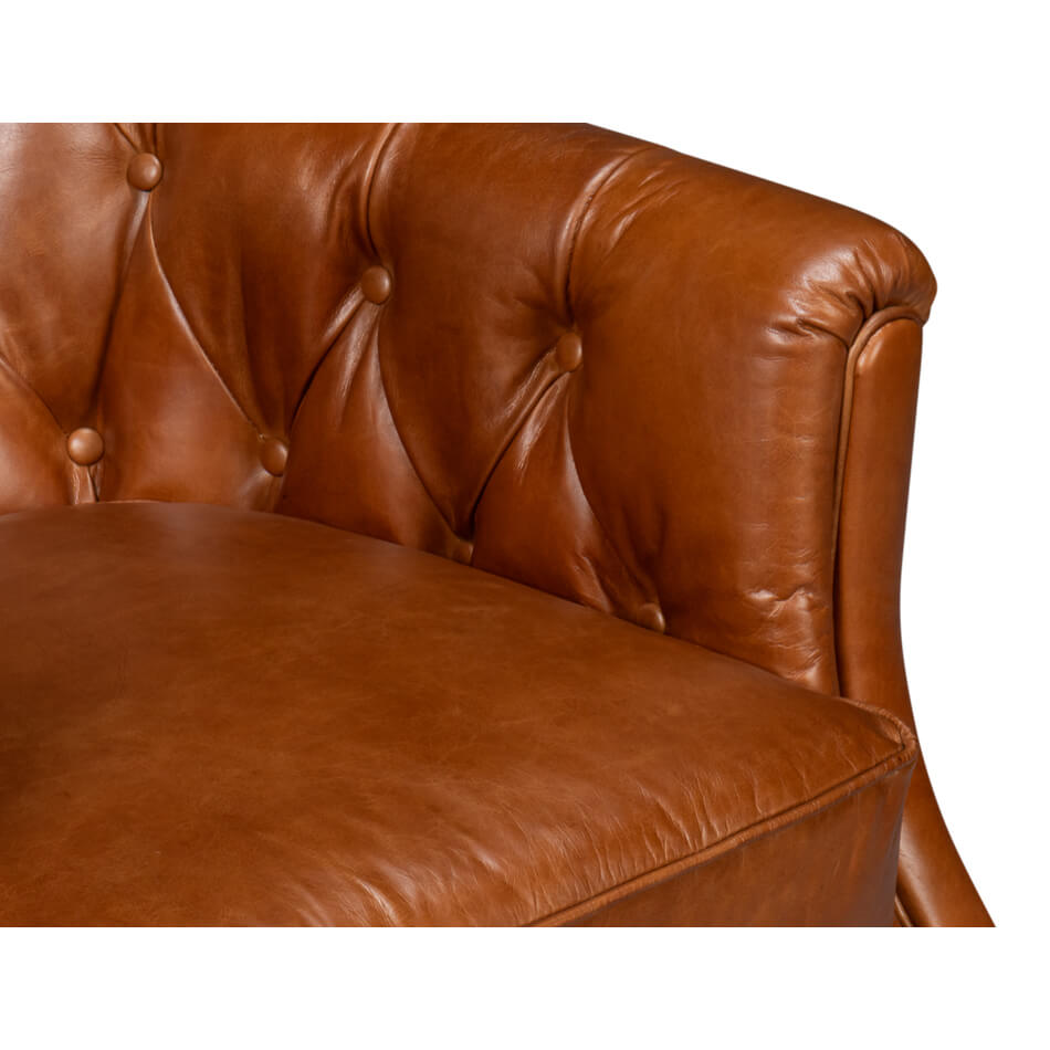 Brown leather armchair, close-up of tufted armrest, button detail.