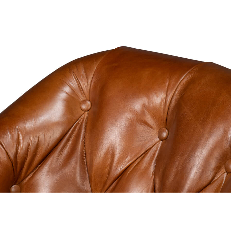 Brown leather armchair, close-up of tufted backrest, button details.
