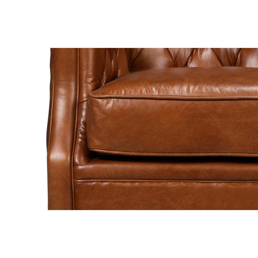 Brown leather armchair, close-up of cushions, detailed leather.