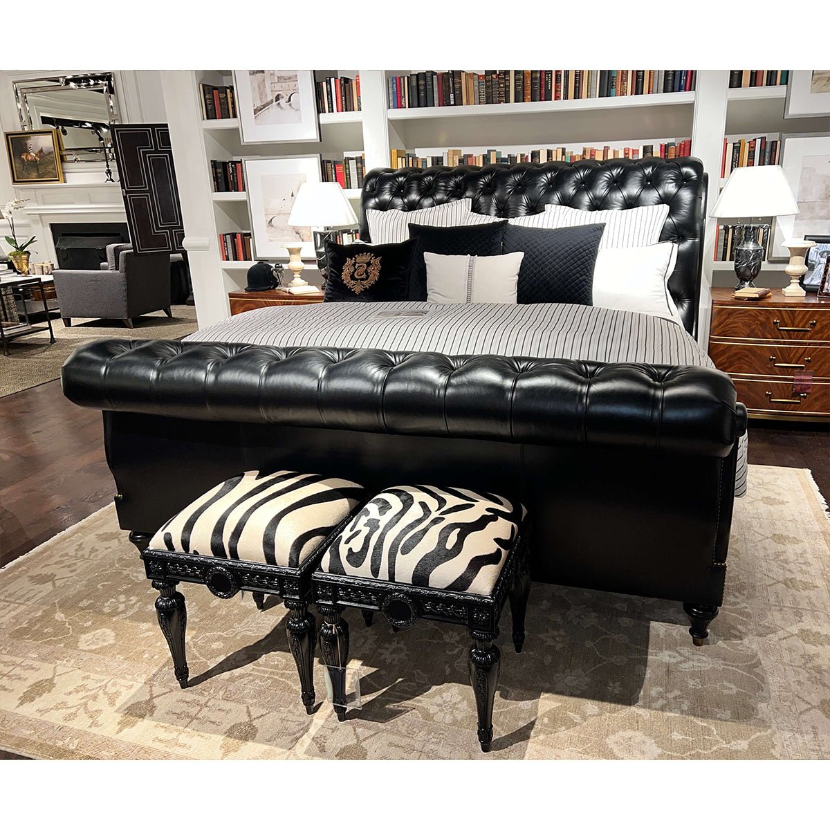 Classic tufted leather king bed in stylish bedroom setting.
