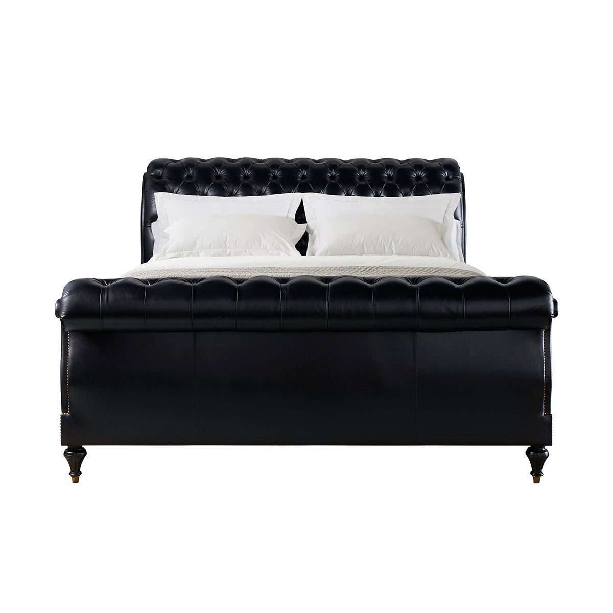 Front view of classic tufted leather king bed.
