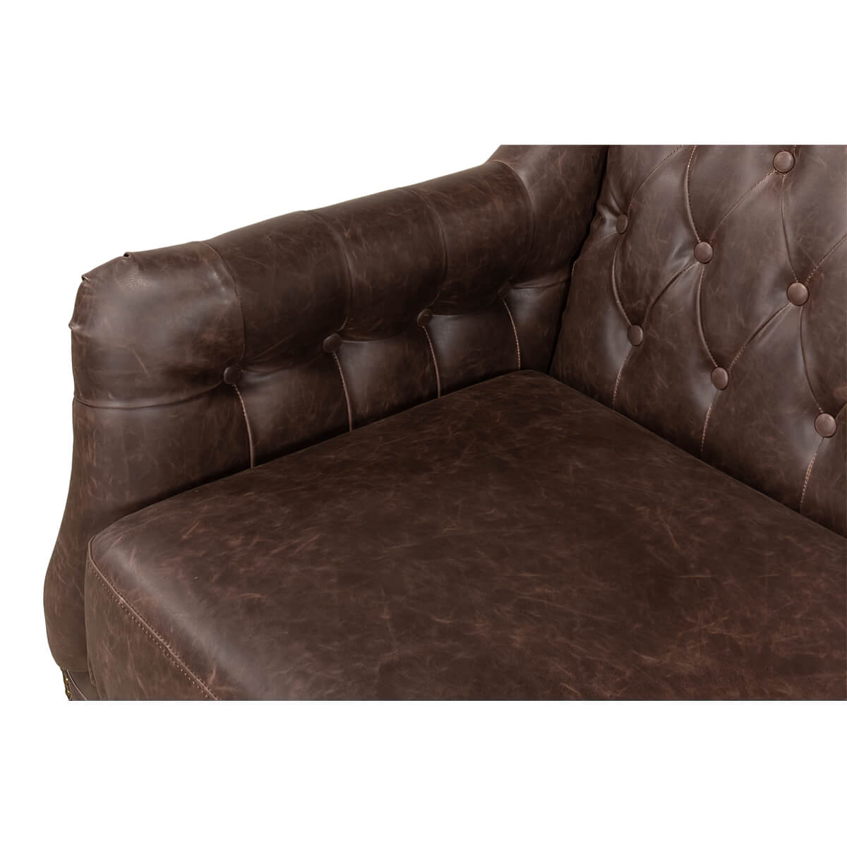 Cushion detail on classic tufted brown leather love seat.
