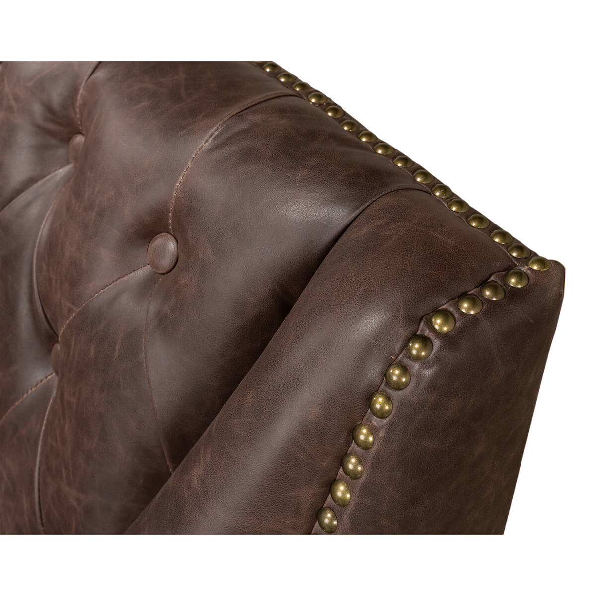 Close-up of button tufting and nailhead trim on love seat.