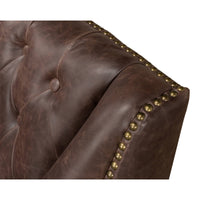 Close-up of button tufting and nailhead trim on love seat.