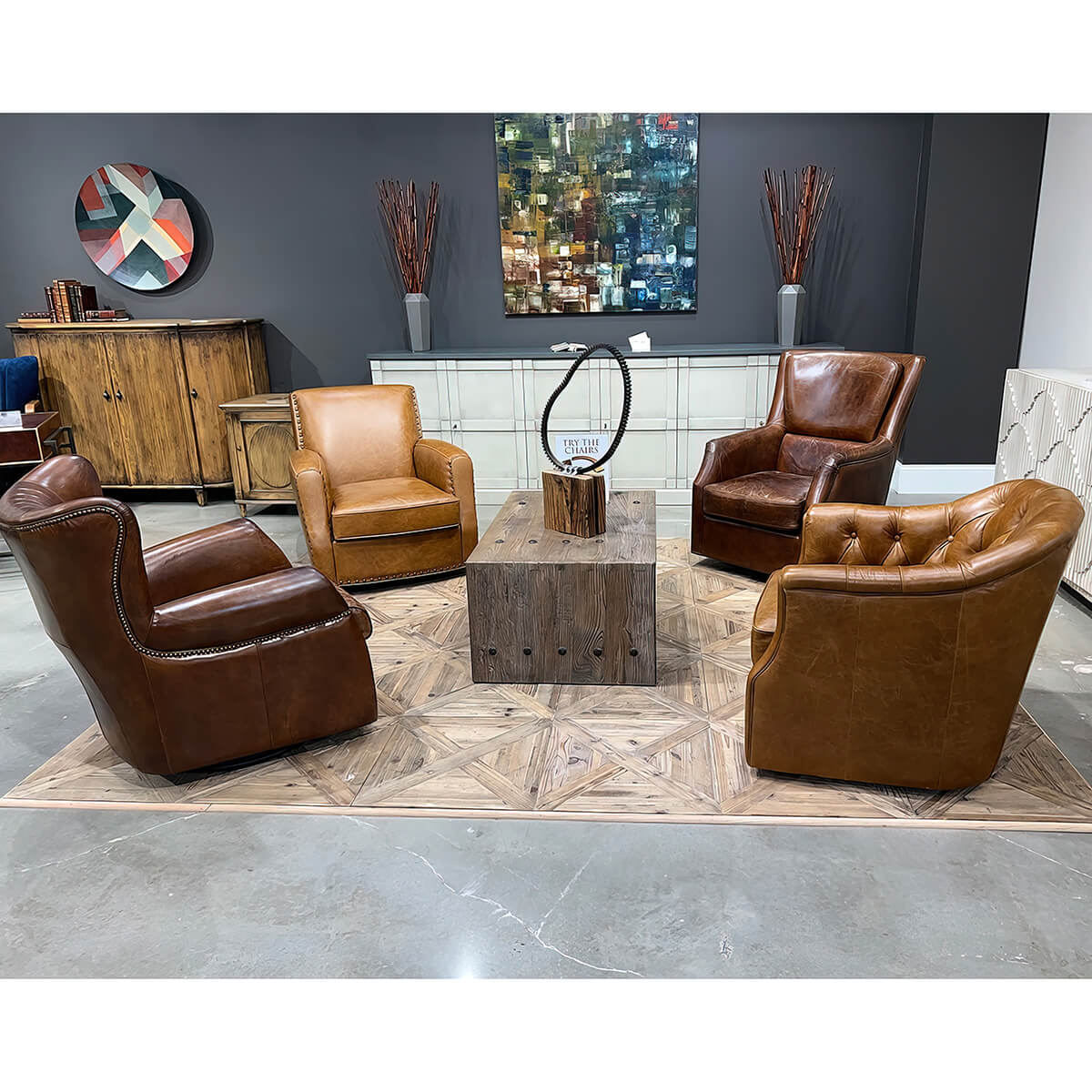 Living room setup with multiple brown and dark chairs.