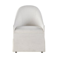 Front view of white skirted dining chair on plain backdrop.