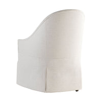 Back angle showing detailing of white skirted dining chair.