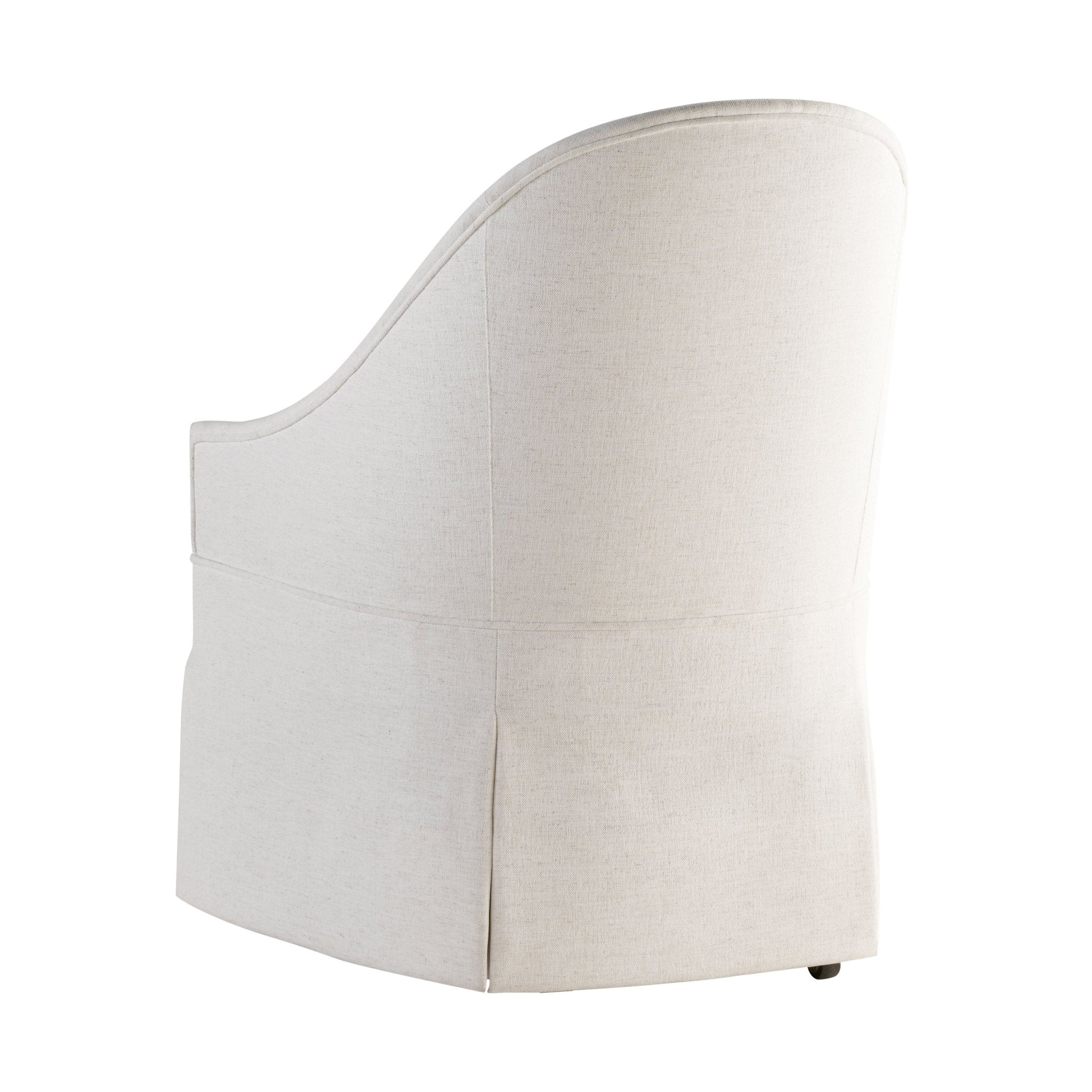 Back angle showing detailing of white skirted dining chair.