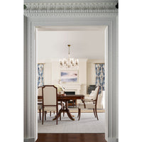 Dining room scene with upholstered chairs around wooden table.