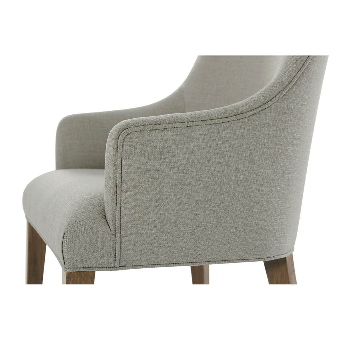 Classic upholstered armchair, armrest close-up, soft fabric.