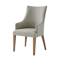 Classic upholstered armchair, front view, wooden legs.