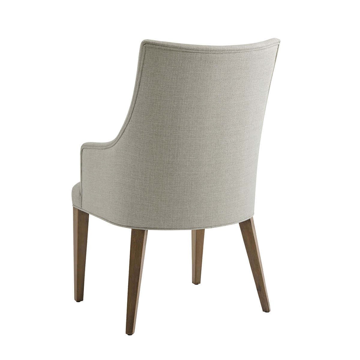 Classic upholstered armchair, back view, sleek design.