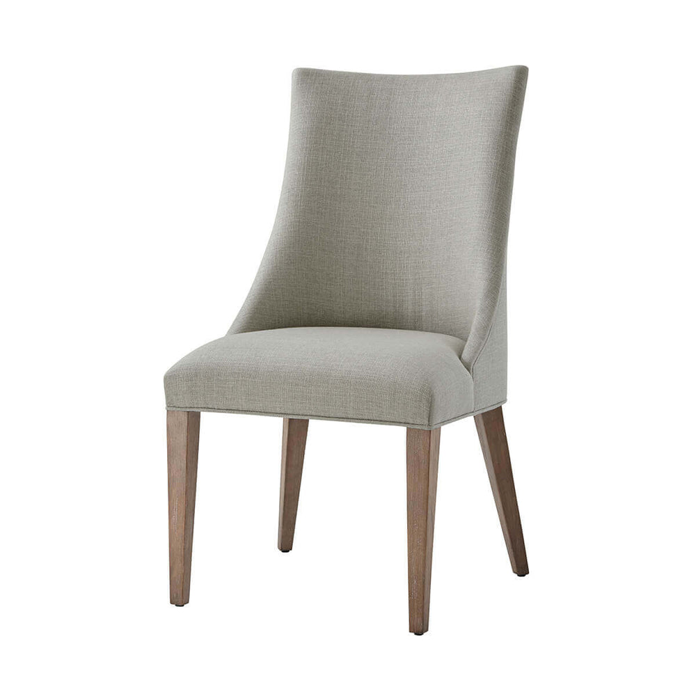 Front view of upholstered scoop back dining chair.