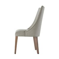 Side profile of upholstered dining chair with scoop back.