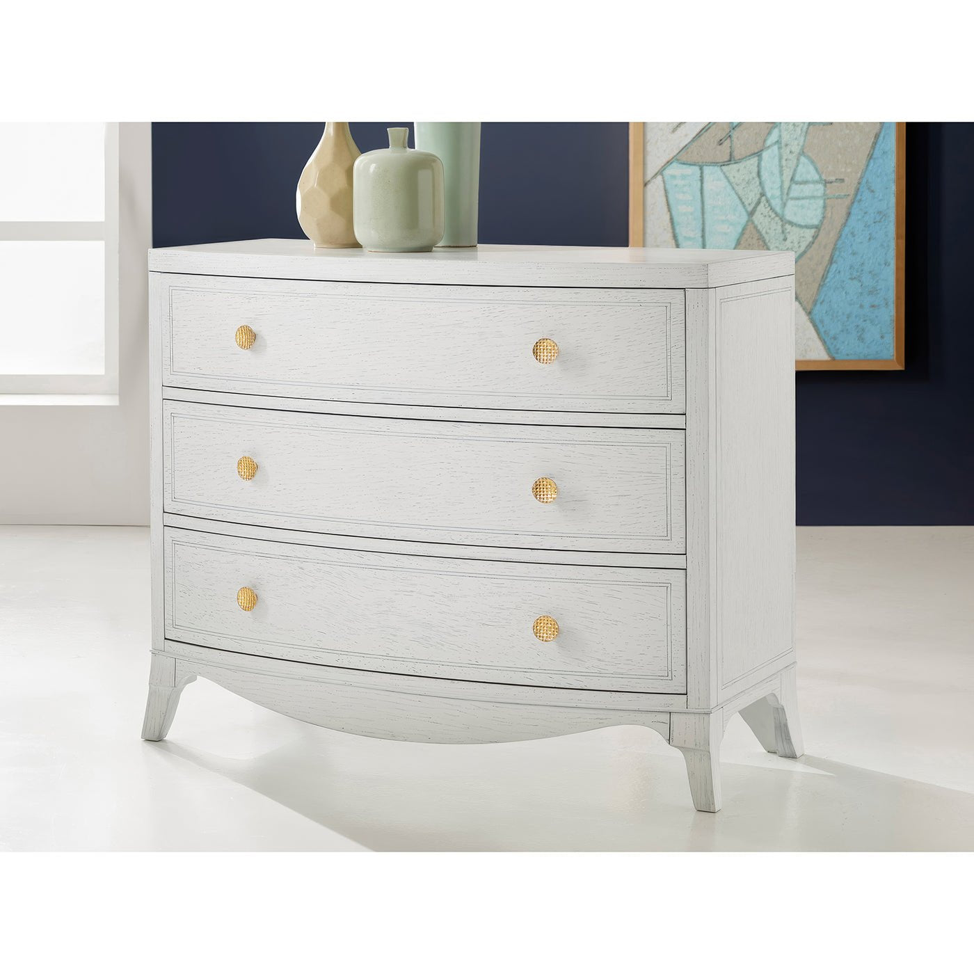 White nightstand angled view in stylish room setting.
