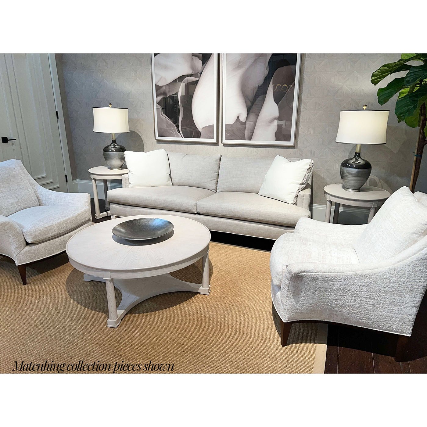 Living room with white round coffee table, matching furniture.