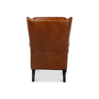 Back view of wingback leather chair detailing stitching.