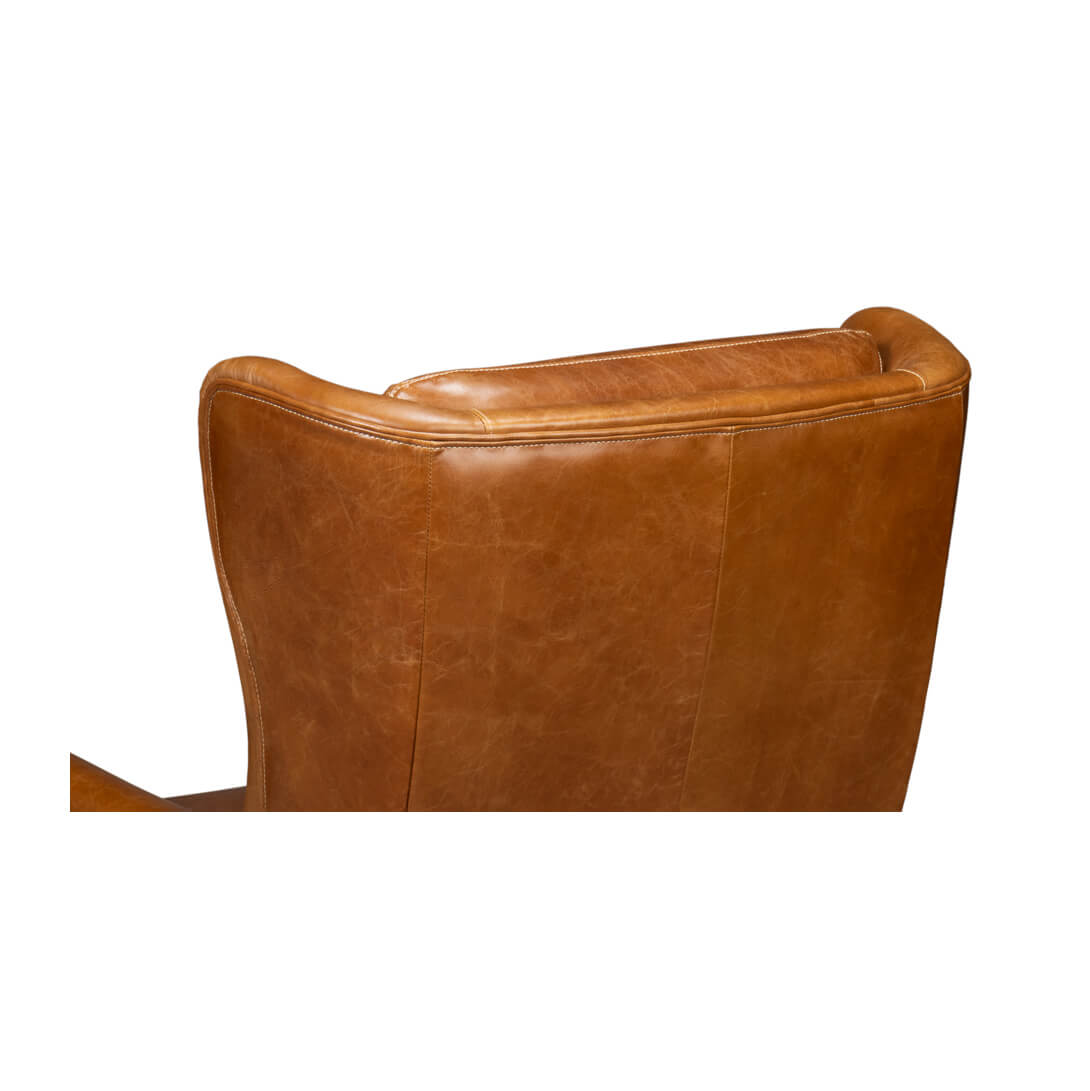 Close-up of back detailing on leather wingback chair.