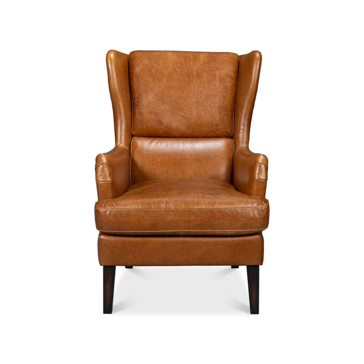 Front view of a classic brown leather wingback chair.