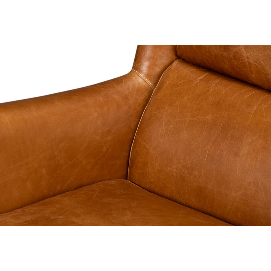 Close-up of seat and backrest of leather wingback chair.