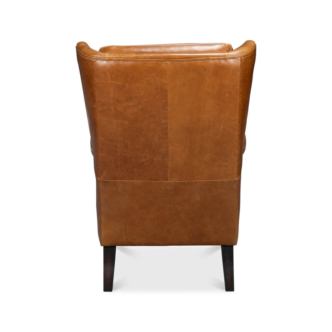 Rear view of brown leather wingback chair.