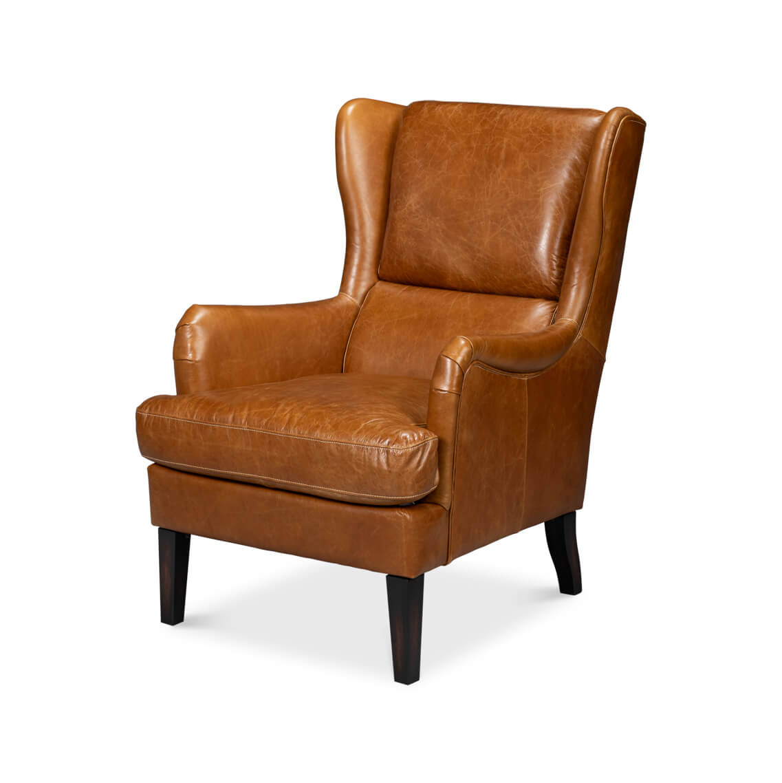 Brown leather wingback chair at an angle view.