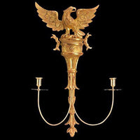 Gold carved eagle sconce with candle holders.