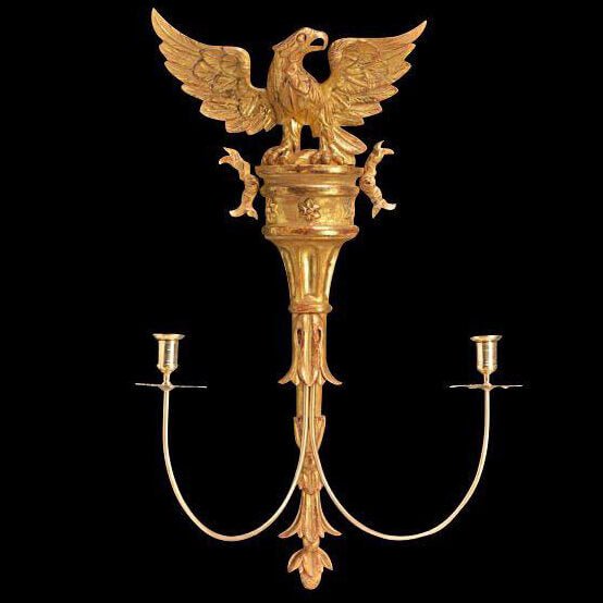Gold carved eagle sconce with candle holders.
