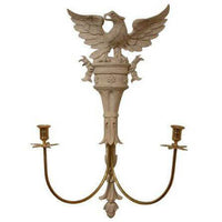 Antique-style eagle sconce with white finish and candles.