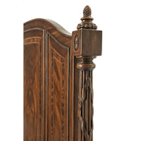 Classic queen size bed, close-up of ornate corner post.