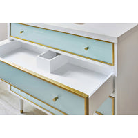 Open drawer of coastal vanity, storage detail, blue and gold.