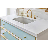 Vanity top, close-up of sink and gold faucet details.