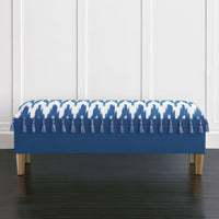 Front view of coastal blue bench with tassel accents.