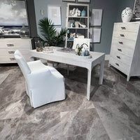 Desk in home office setting, modern decor around.