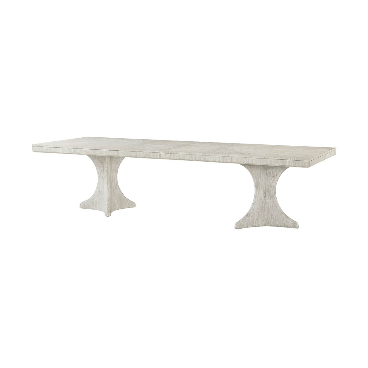 Extended white dining table with double pedestal base, isolated.