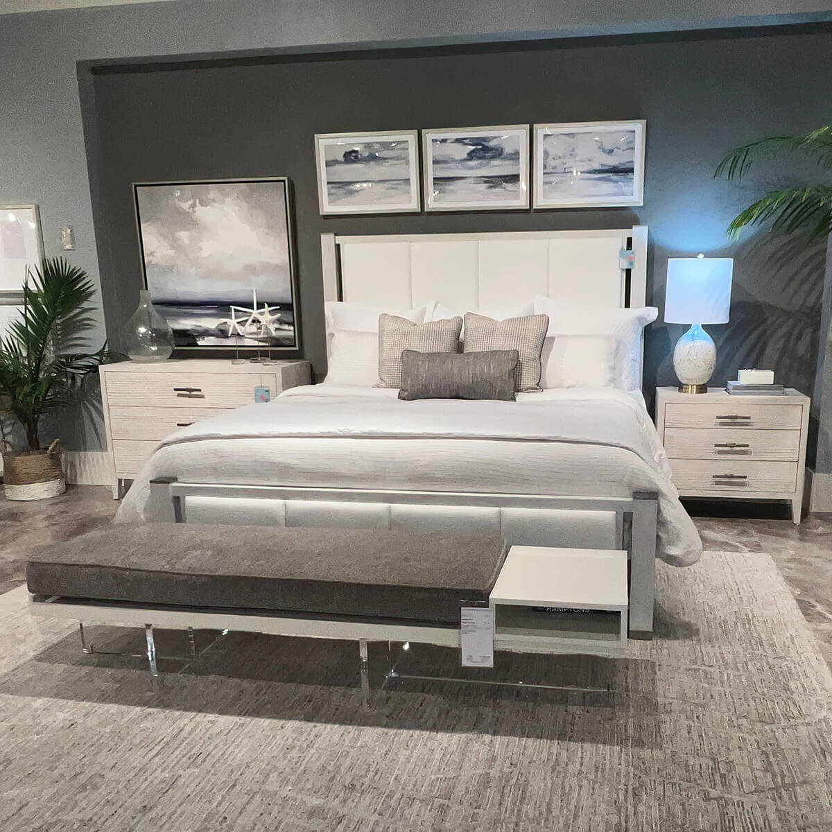Coastal queen bed in styled bedroom with matching decor.