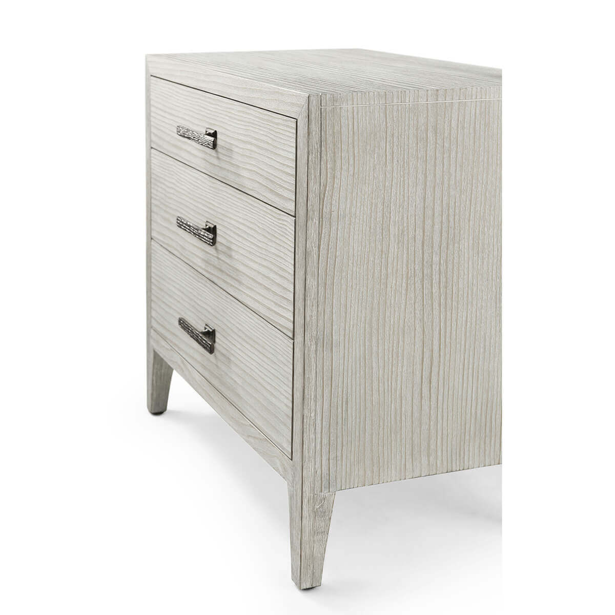 Nightstand side angle, drawer handles visible, light wood texture.
