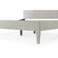 Close-up of bed's footboard and legs.